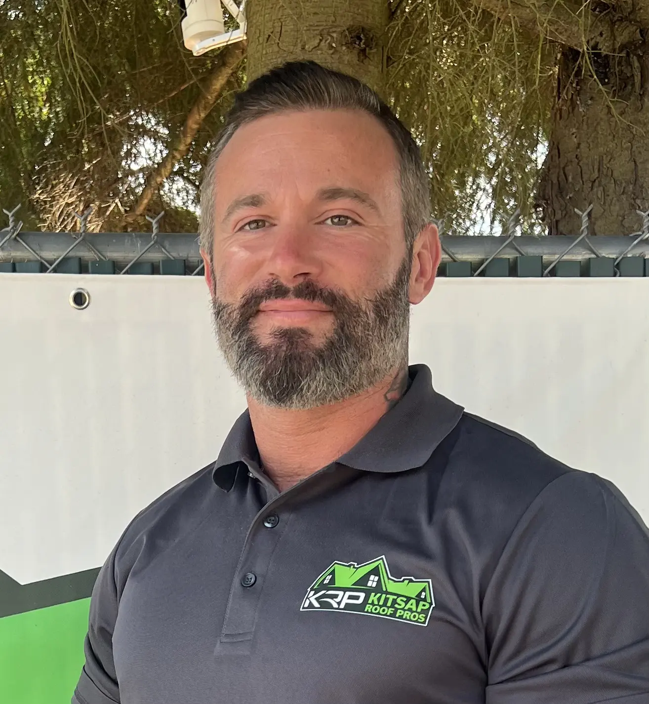 headshot of kitsap employee, justin richardson, wearing kitsap polo